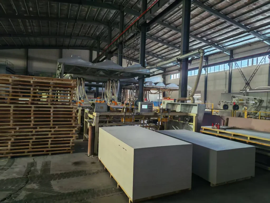 Finished fiber cement boards beside the production line
