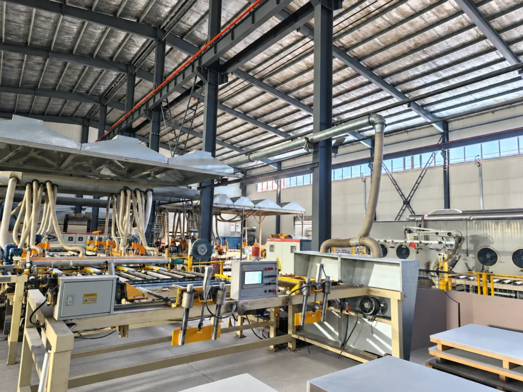 Fiber cement board production machinery and extraction ducts inside the factory